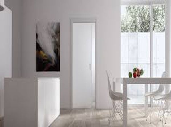 Porte coulissante Eclisse Unique installée dans un salon moderne